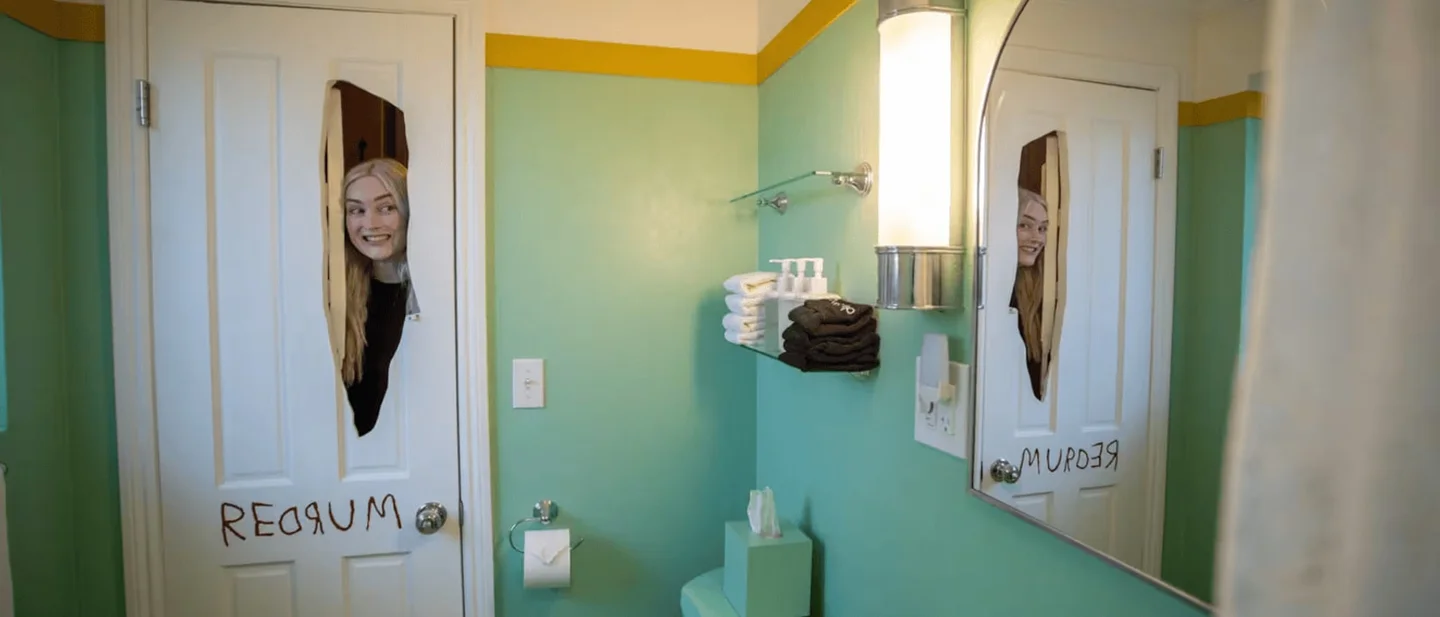 This Big Bear cabin has an axe-shaped hole in the bathroom door and a locked cabinet guests are invited to crack