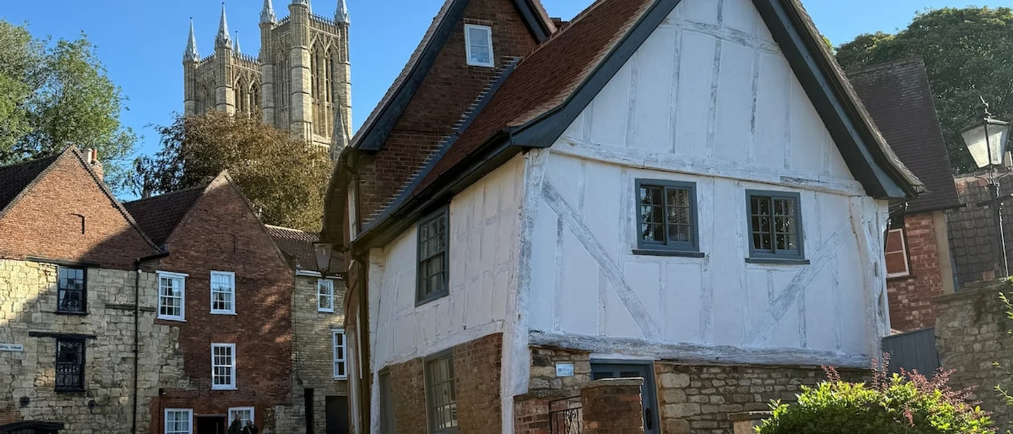 A 500-year-old house in Lincoln leans because of gravity. You can now stay in it.