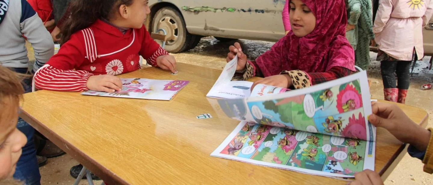 In Syria, a painted bus brings books and play to children in camps