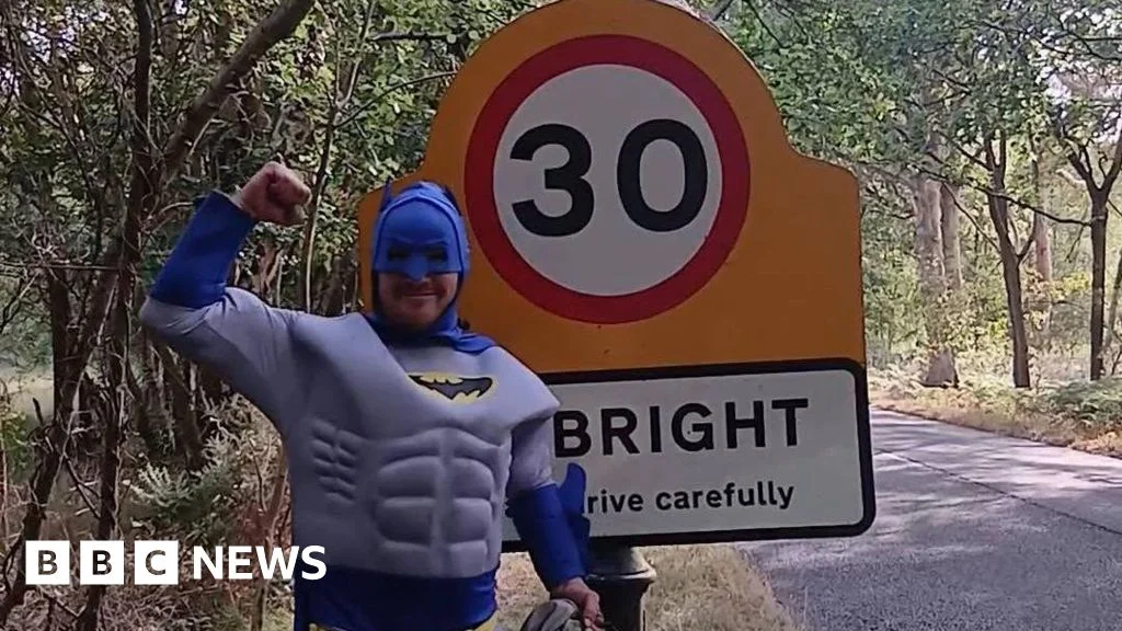 The Batman cleaning Surrey’s signs started with a debt to his neighbours