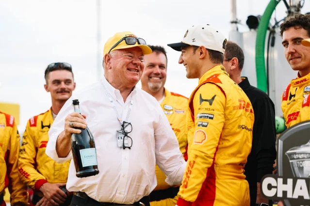 Pato O'Ward and his team celebrate at the Milwaukee Mile