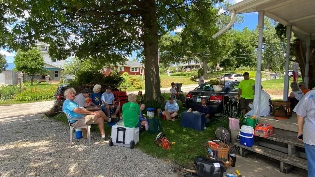 Volunteers gather outside during Matthew 25's Transform Week in Cedar Rapids.
