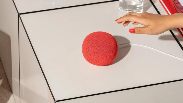 Red Google Home Speaker on a table