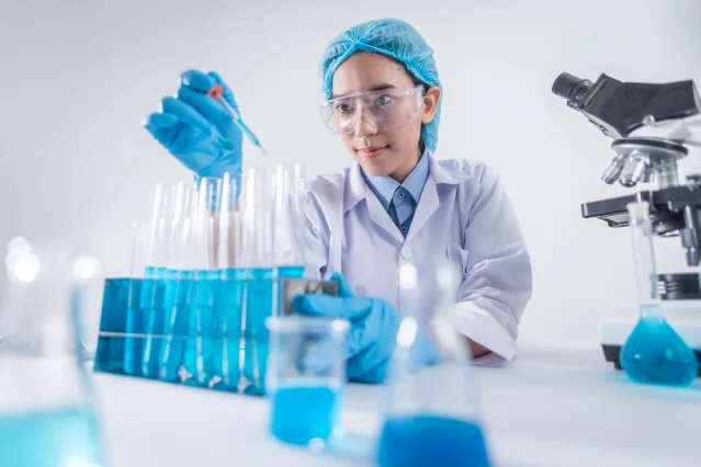 Two scientists examining glowing DNA gel results in a dark laboratory, representing genomic therapy research