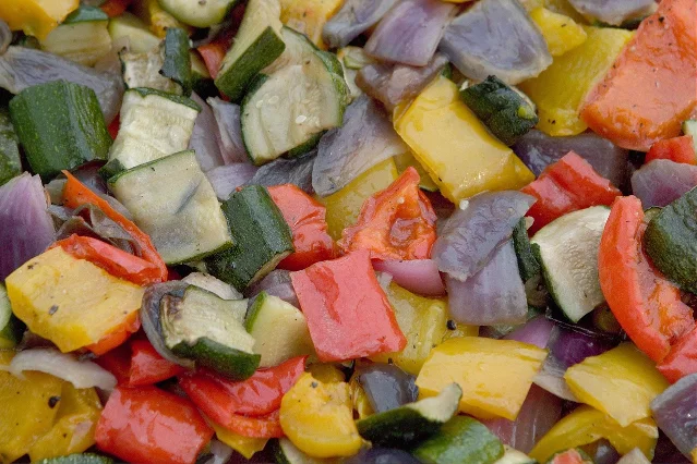 Chunks of courgette, red pepper and red onion roasted together, cut to a similar size