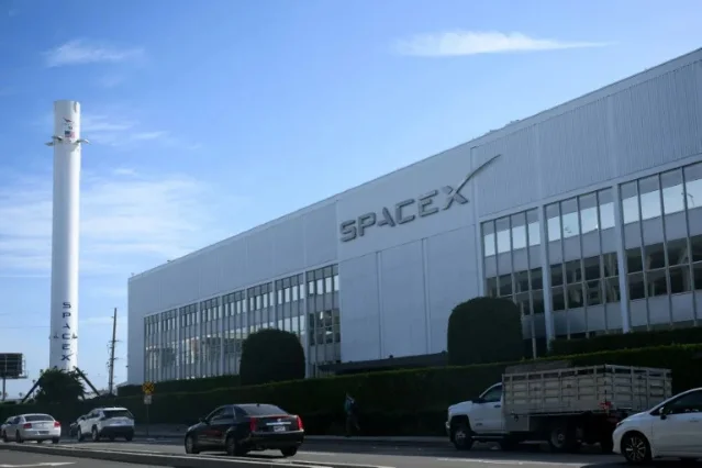 SpaceX headquarters in Hawthorne, California, with a Falcon 9 rocket shell out front