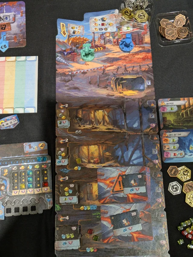 Drillers mine board with layered levels and side cards from the Gen Con CGE room.