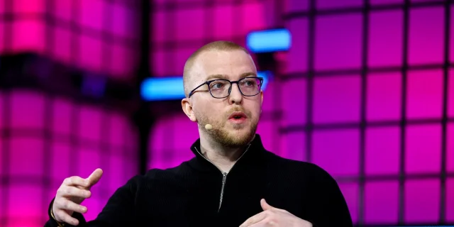 TensorWave CEO Darrick Horton speaking at a conference