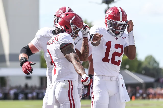 Alabama receiver Ryan Coleman-Williams and quarterback Keelon Russell celebrate a touchdown against Mississippi State