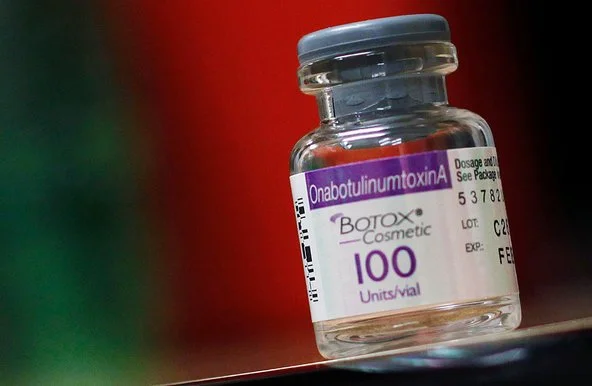 A bottle of Botox Cosmetic, Allergan's flagship product, on a colored surface