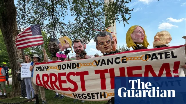 Protesters near the White House with large puppet figures