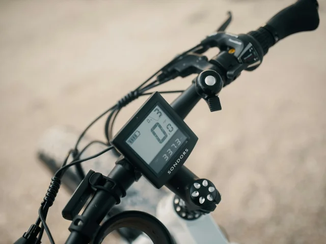 eBike handlebar display showing assist level and speedometer