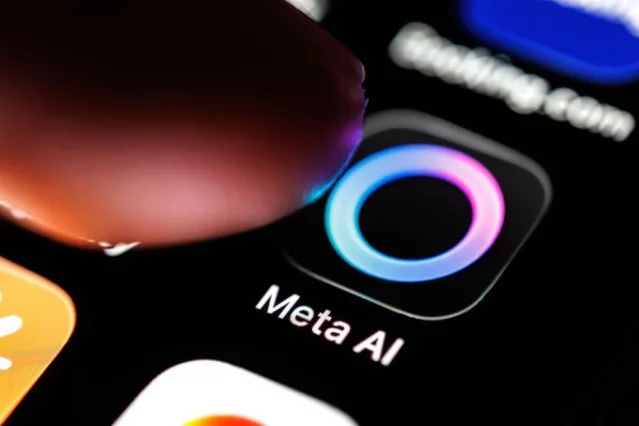 Meta AI app logo on a smartphone, with a finger tapping to open the app