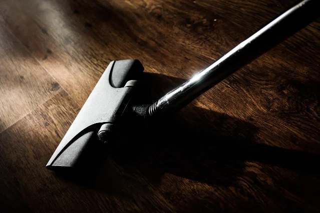 A vacuum floor head on wood flooring