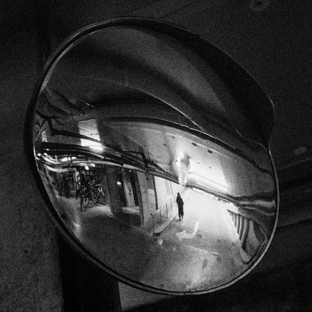 Upon Reflection album cover — convex rearview mirror reflecting a black-and-white underground corridor, with "HAND CLAP UPON REFLECTION" printed in each corner