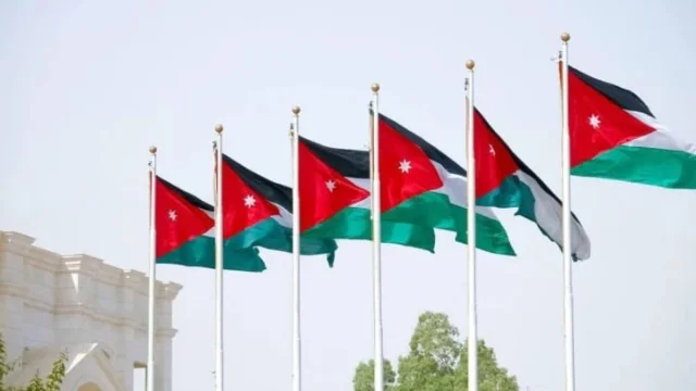 Jordanian flags outside a government building