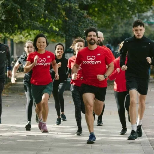 GoodGym members running together in red shirts