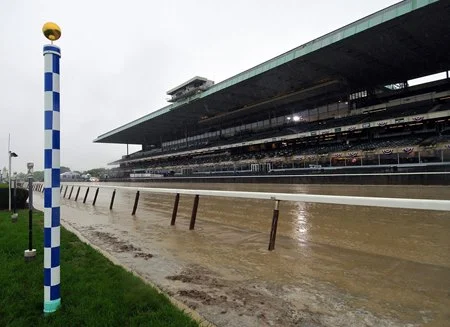 The blue-and-white striped Secretariat margin pole on the Belmont Park track, marking 253 feet 2 inches from the finish line