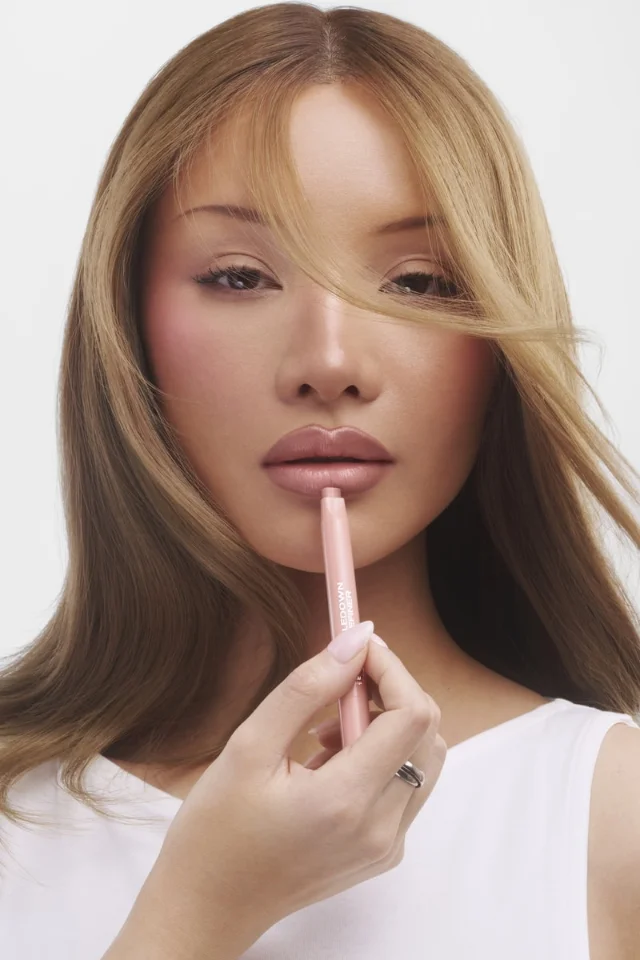 SACHEU DoubleDown Lip Definer in shade Off Duty — 2-in-1 bullet shows the dual-tone tip, darker liner edge alongside the lighter balm fill