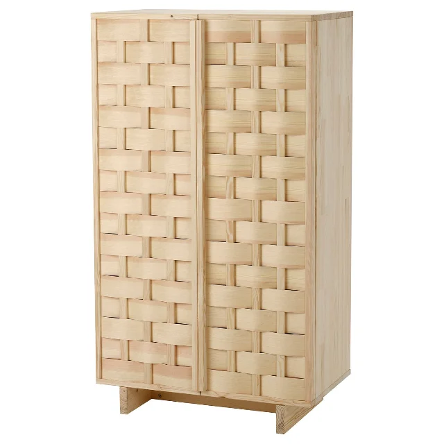 IKEA PS 2026 pine cabinet with handwoven doors, standing closed against a plain background
