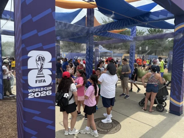 Fans walk through misting and water stations at Houston's FIFA Fan Festival
