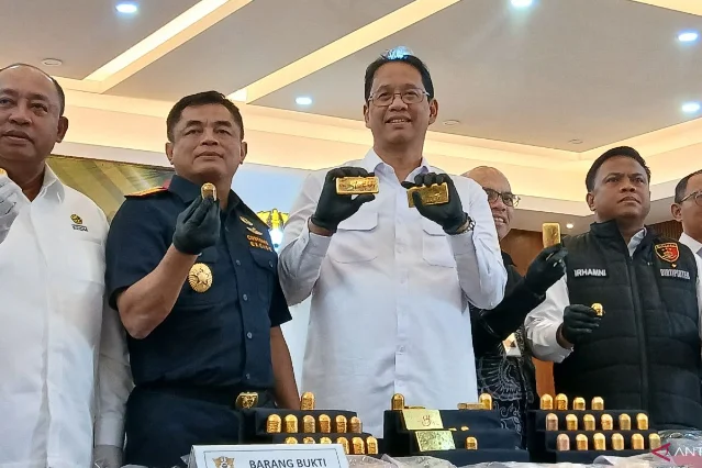 Indonesian officials display gold recovered in two airport smuggling cases.