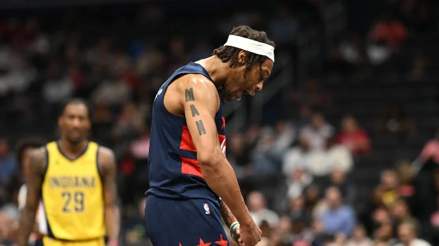 Washington Wizards guard Alondes Williams in a navy uniform during a game.