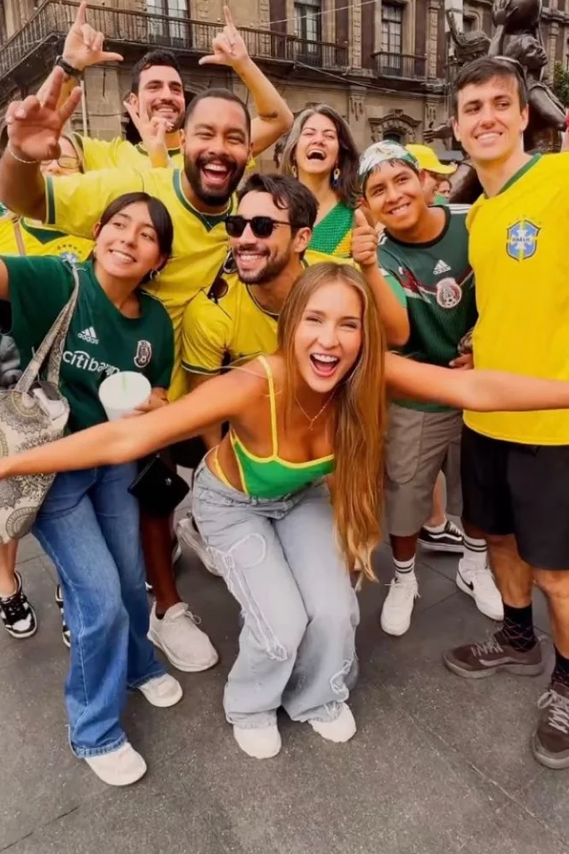 Fans in Brazil and Mexico shirts posing at the Mexico City Fan Festival