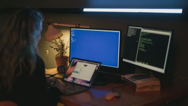 Freelancer working across multiple screens