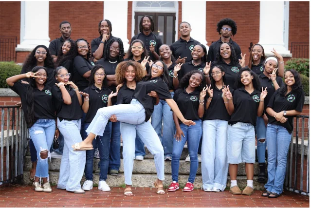 Dream Day Ambassadors gather with program adults at a school event.