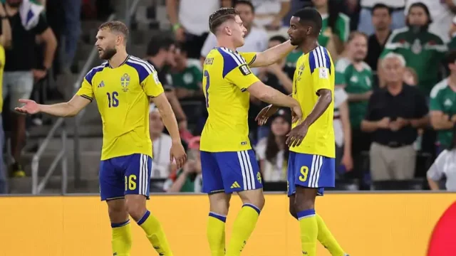 Alexander Isak and Viktor Gyökeres celebrate Sweden's goals against Tunisia