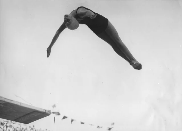 Marjorie Gestring arches through the air above a springboard during an Olympic-era dive.