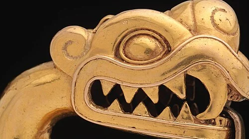 Close-up of the head detail showing surface engraving and facial features