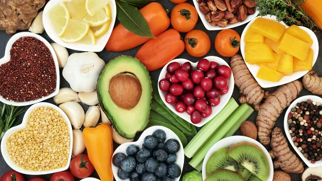 Fiber-rich foods including fruit, vegetables, legumes, and whole grains