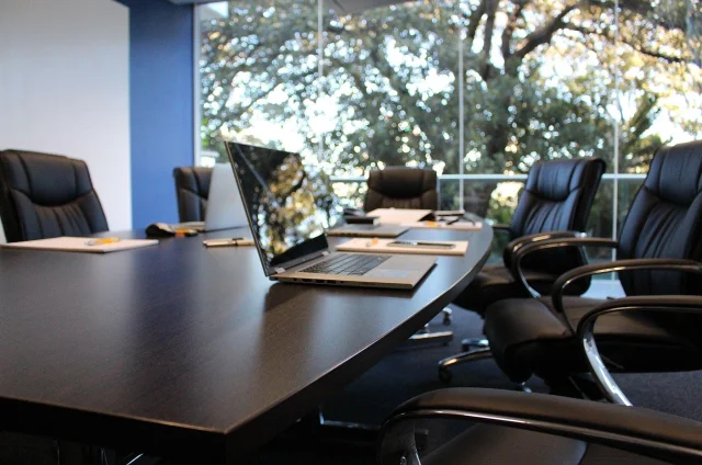 An empty corporate boardroom — the setting where Vivendi's board repeatedly approved Messier's acquisition spree