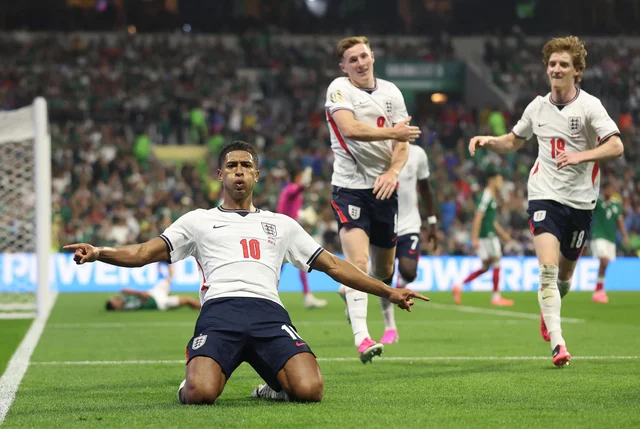 Jude Bellingham celebrates after scoring for England against Mexico at Mexico City Stadium.