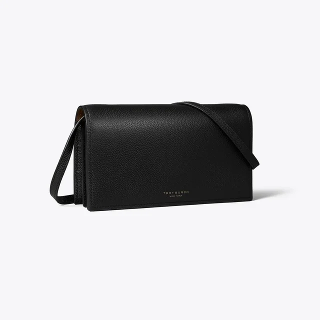 Black pebbled-leather Tory Burch wallet crossbody with a thin shoulder strap, photographed against a pale ground