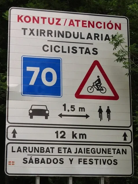 A bilingual road sign with Basque and Spanish text