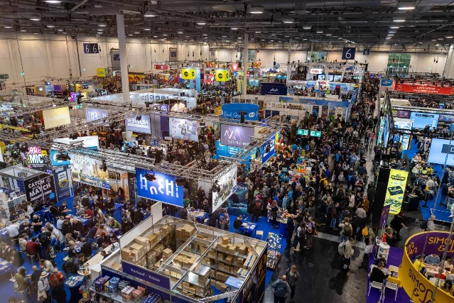 A crowded SPIEL Essen exhibition hall viewed from above