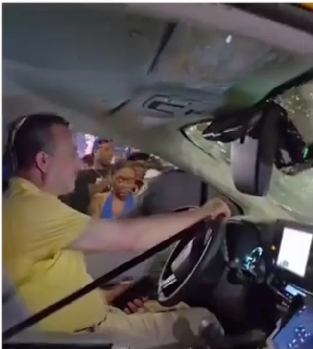 Noureddine Bitat sits inside the damaged cab