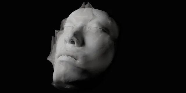 A translucent white face-like bacterial biofilm form floats against a black background