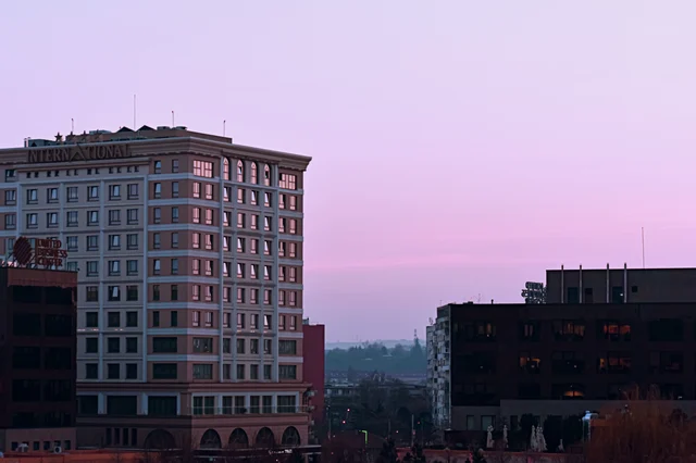 Modern hotel complex at dusk, representing the hospitality and real-estate franchise businesses at the heart of the HFS–CUC combination