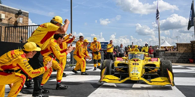 Alex Palou's No. 10 IndyCar and the Chip Ganassi Racing crew celebrate in Nashville