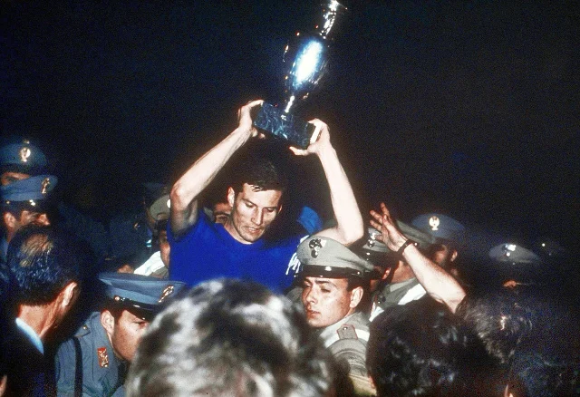 Giacinto Facchetti lifts the Henri Delaunay Trophy after Italy's Euro 1968 victory