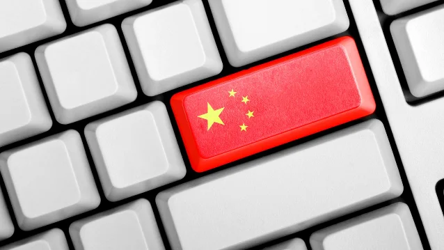 Illustration of a computer keyboard with a red return key resembling China's flag