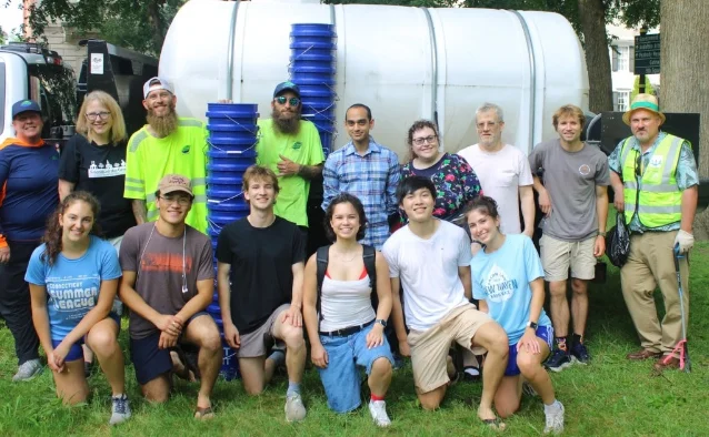 Volunteers gathered after watering trees on the New Haven Green