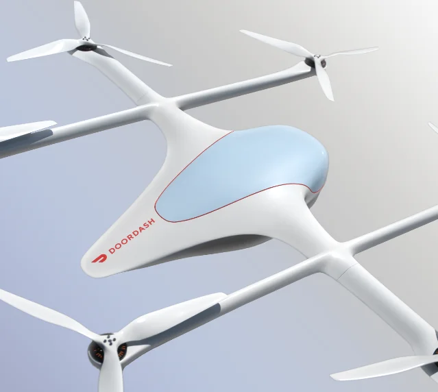 DoorDash Air 六旋翼无人机的官方产品渲染图,白蓝配色机身带红色 DoorDash 标识