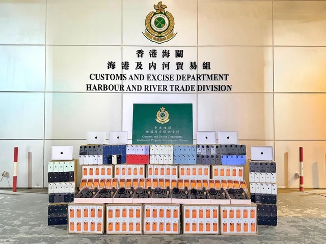 Hong Kong Customs display of suspected counterfeit phones, laptops, bags, shoes and accessories