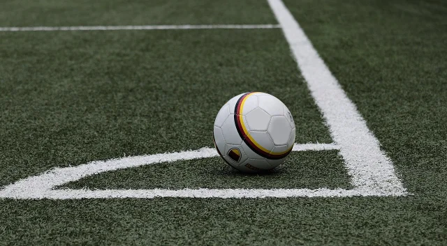 Soccer ball on an empty pitch at training