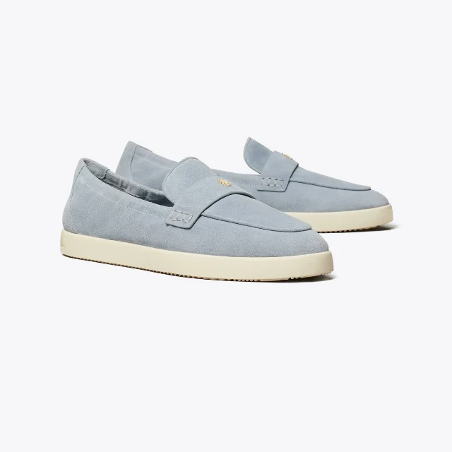 Angled studio view of the Tory Burch Ballet Sport Loafer in light blue suede with a cream rubber sole and gold logo stud